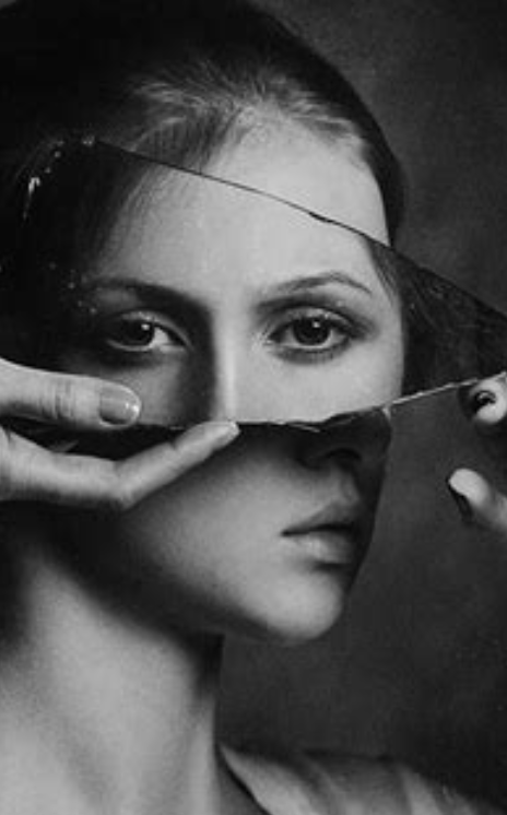 Hot Ballet — black-and-white portrait of a woman, her face fragmented by a shard of broken mirror.
