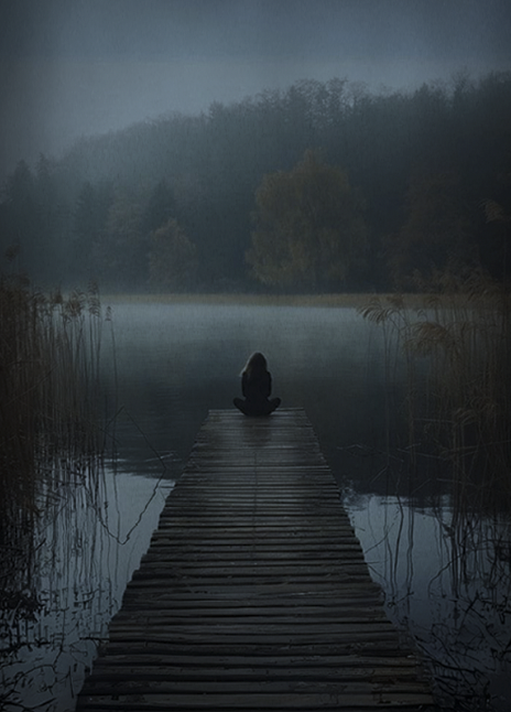 Little Earthquakes — a hooded figure sitting at the end of a misty wooden pier on a still lake.